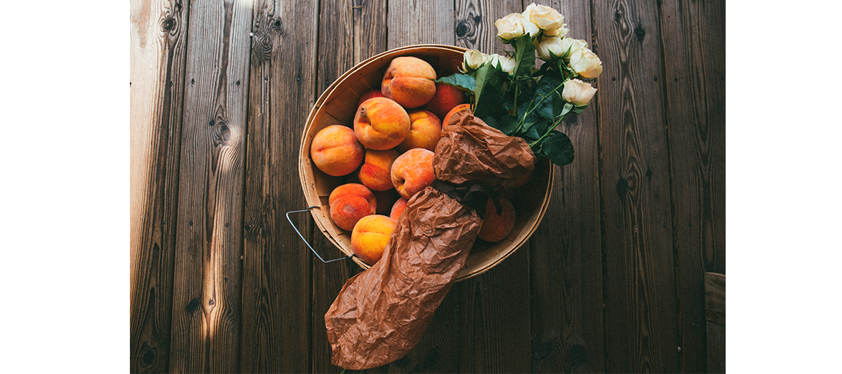 peaches and white flowers on a table 