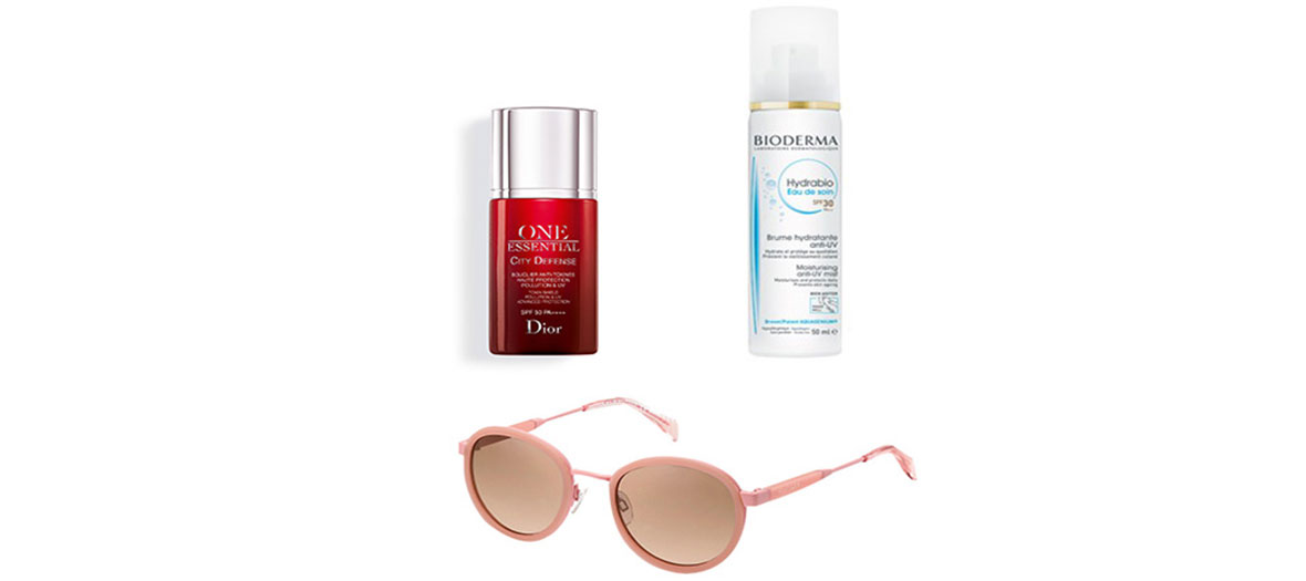 Lunettes roses, spray et crème solaires 