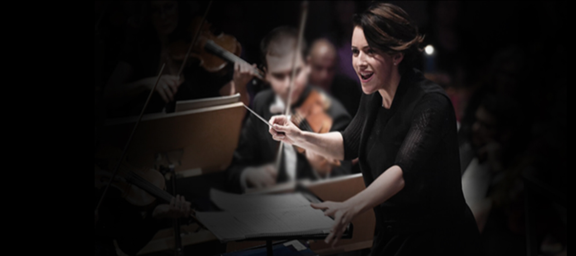 Alondra de la Parra conducting an orchestra