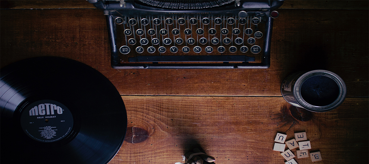 Coffee cup, typewriter and a vinyl