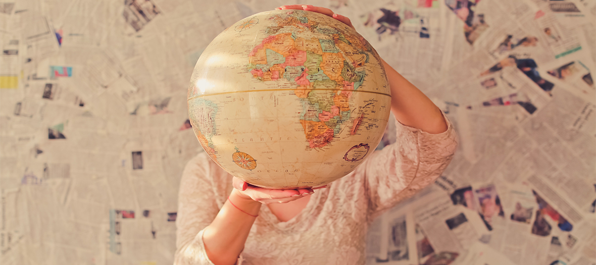 Woman holding a globe