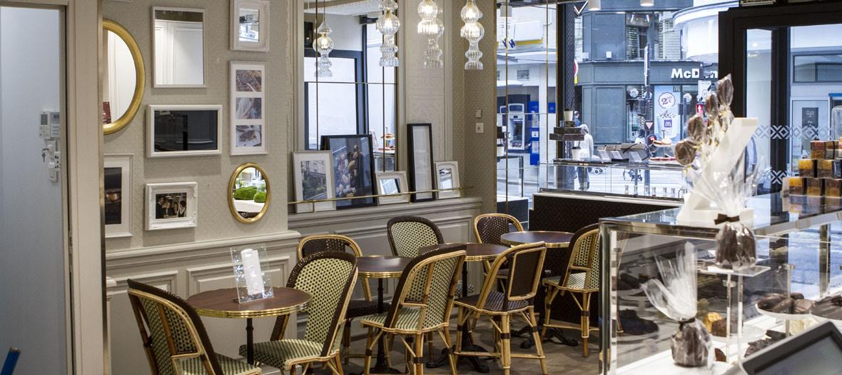 Interior atmosphere and decoration of the Michel Cluizel Tea Room with paintings, chocolates, caramels, pralines
