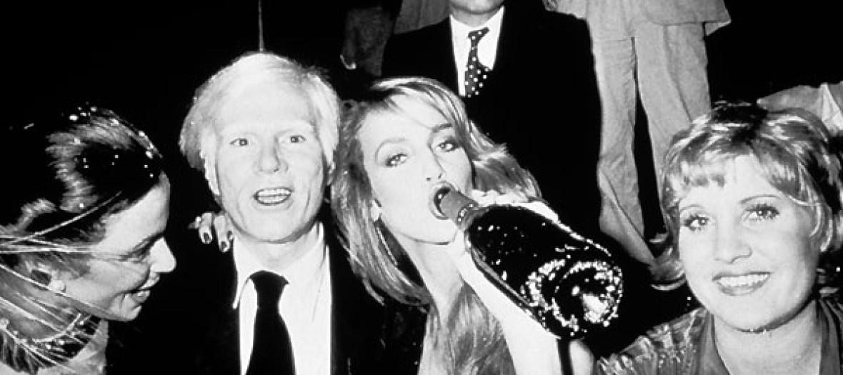 Andy Warhol, Jerry Hall and their friends who make party at club 54 in New York