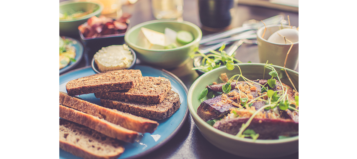 Breakfast with orange juice, tea and french toast with morning bread by Juliette Gernez