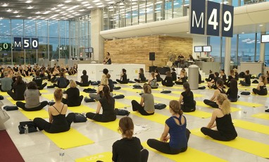 people doing yoga in a room boarding 