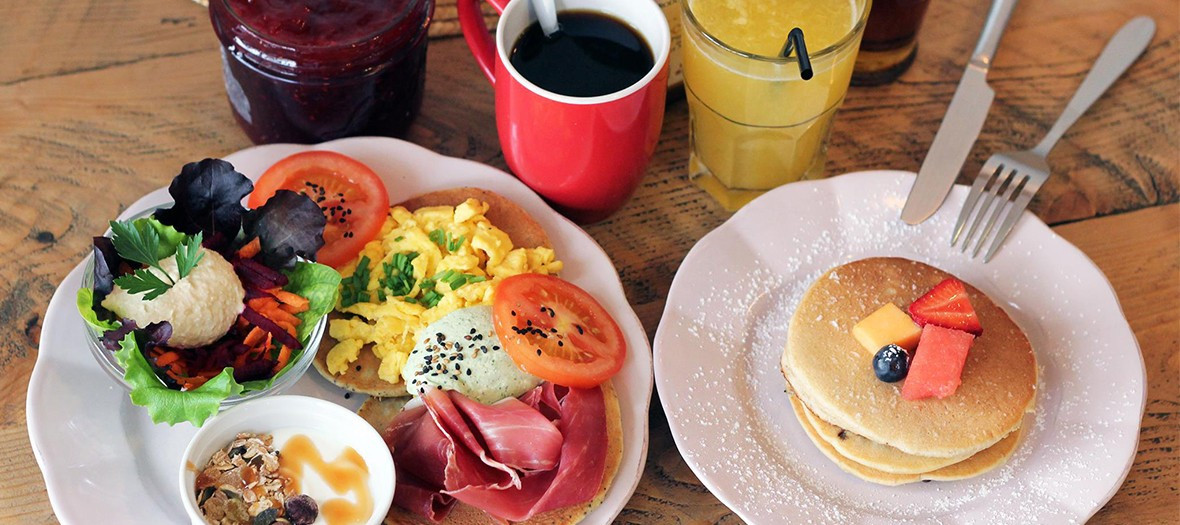 Salad dishes, toasts, fruit juice, coffee, jam, ham