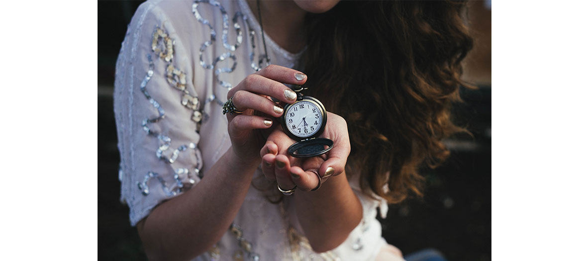 Girl holding a watch