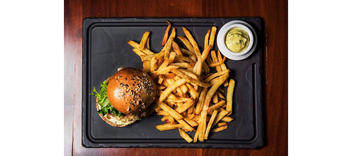 Homemade fries dish and hamburger from Roger la Grenouille restaurant