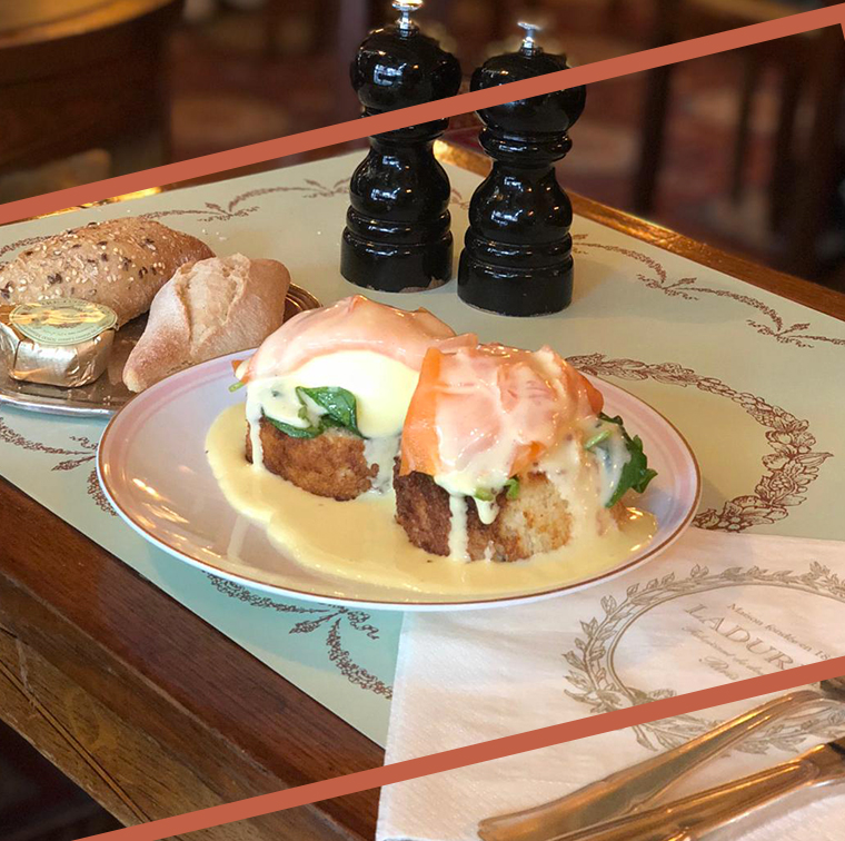 Brioche bread, spinach and poached eggs covered with salmon