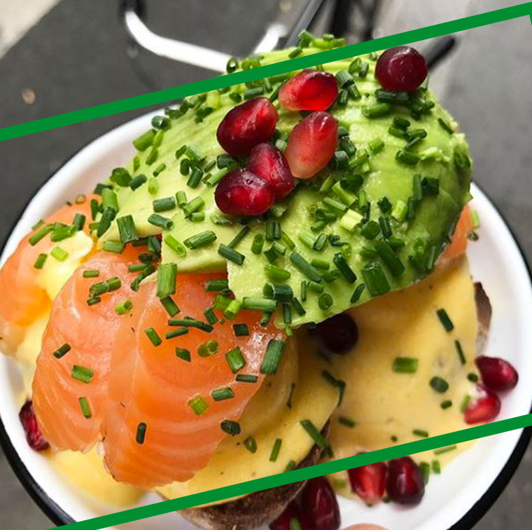 Benedict egg salmon, avocado, toaste bread and pomegranate