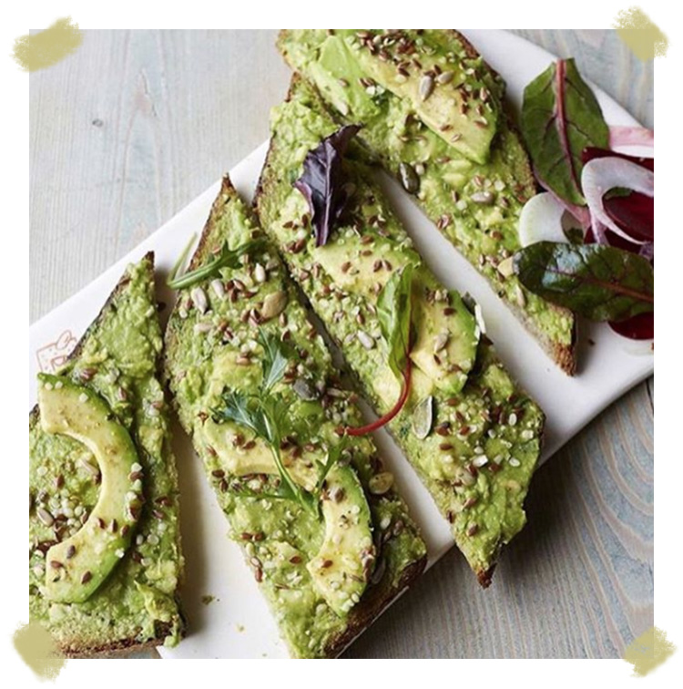 pain quoitidien avocado toast with Poilane bread and roquette salads in Paris