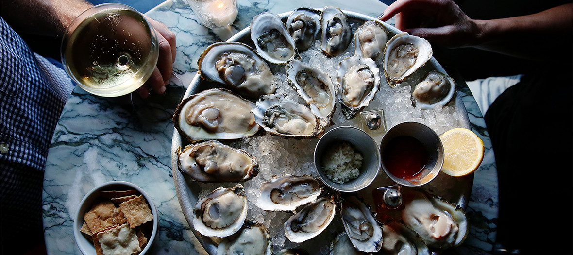 An oyster mushroom with lemon, spices and glass of Champagne