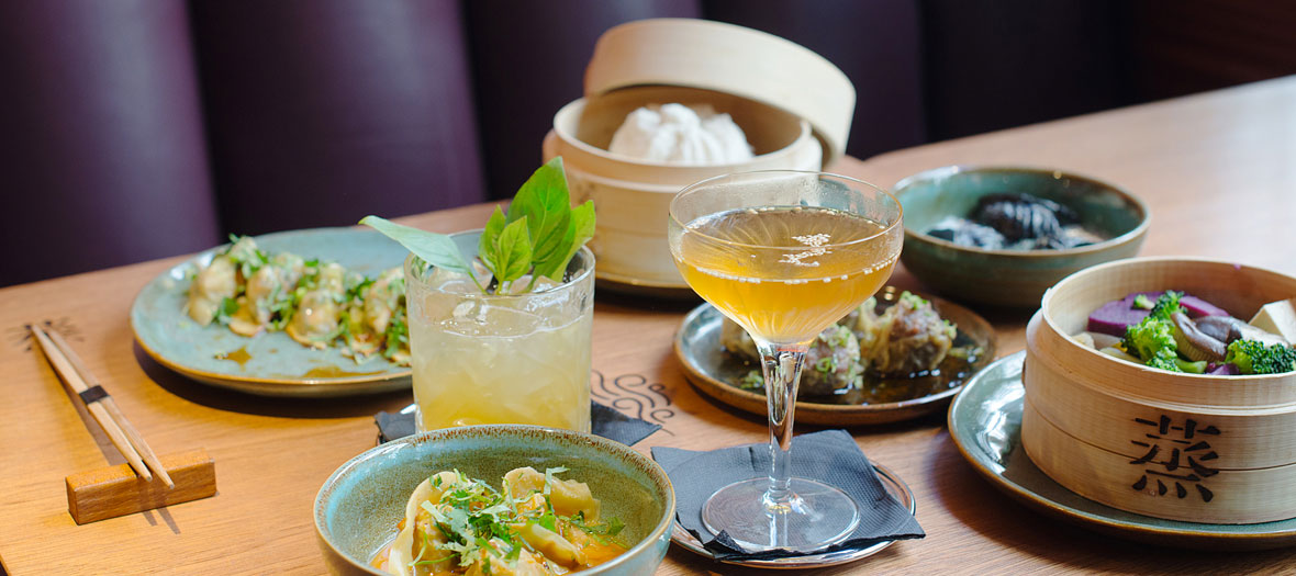 Steam bar dishes that includs Dim sum baskets steam and unveil Peking duck baos and ha kao of eggplant and Thai et pesto basil