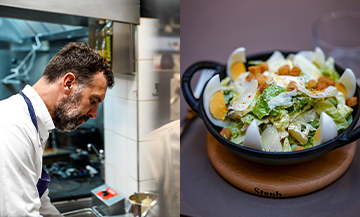 Chef Christian Constant in the kitchen with a cesar salad