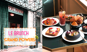 Façade de l’Hôtel Grand Powers et table de petit dejeuner avec croissant, viennoiserie, fruit et jus de fruit
