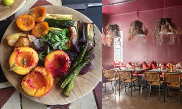 Confected dish of asparagus, eggplant, rocket salad, apricot, peach and decoration of the dining room of the restaurant