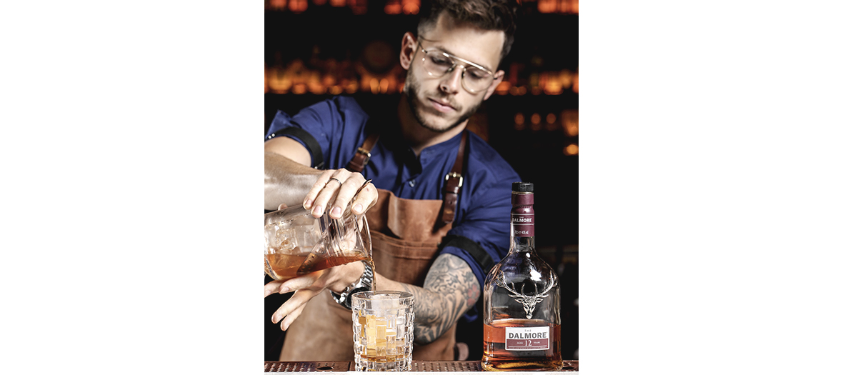  Portrait of the bartender chef Eric Sablonnière preparing a cocktail at the Roxo restaurant