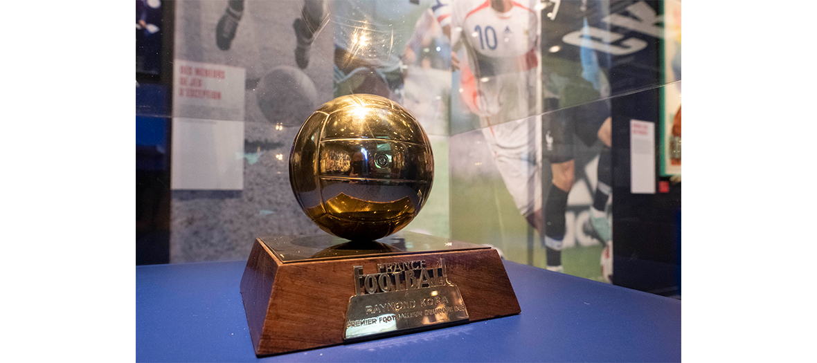 golden ball trophy of Raymond Kopa exposed in a showcase at institut du monde arabe