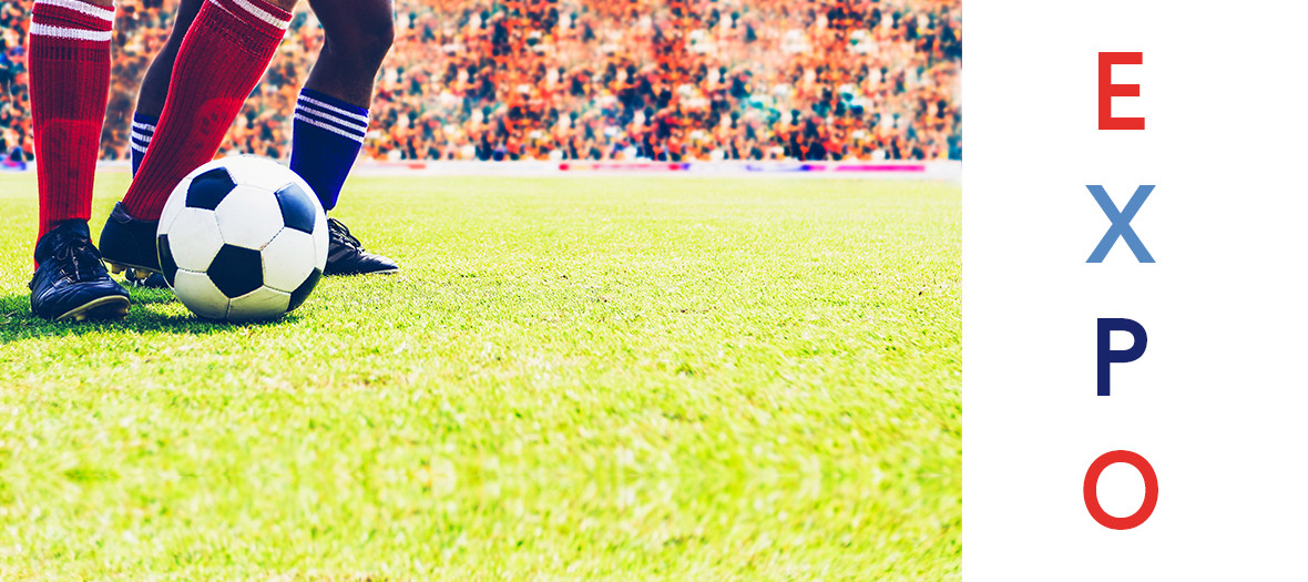 Football ball on the grass in a football stadium