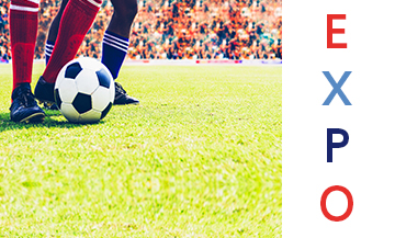 Football ball on the grass in a football stadium