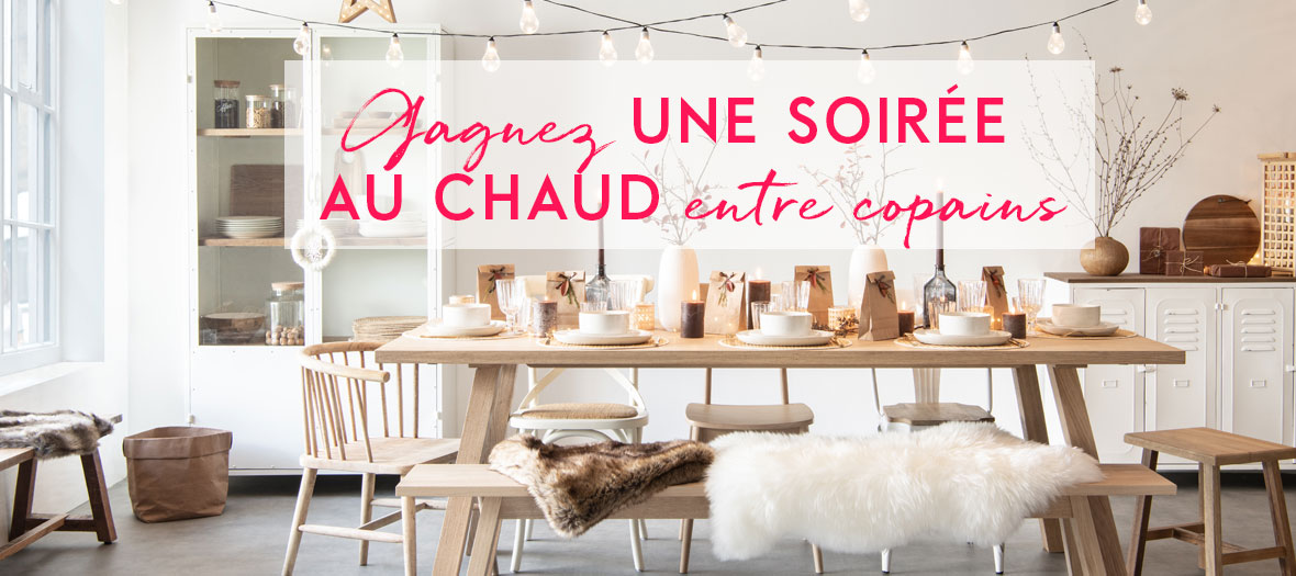 Maison Du Monde Santa Show avec les cadeaux à partager, les bougies sur la table et le design cosy.