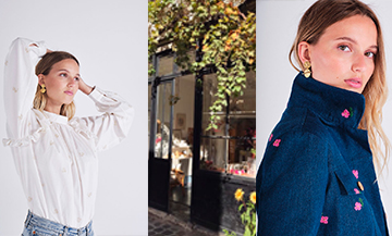 Facade de la boutique, blouse blanche en coton brodé de fleurs dorées et veste en jean avec des fleurs brodées