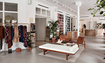 The Libre Service concept store with a chic decor with immaculate walls and handsome wood furniture picked out by the owner and her team, all enhanced by tall plants that make you feel like spending hours there