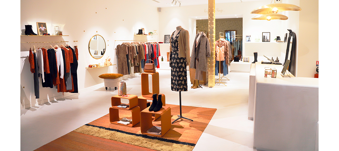 The boutique-workshop with its dresses, flowery blouses, little knitted cardigans, coats, boots