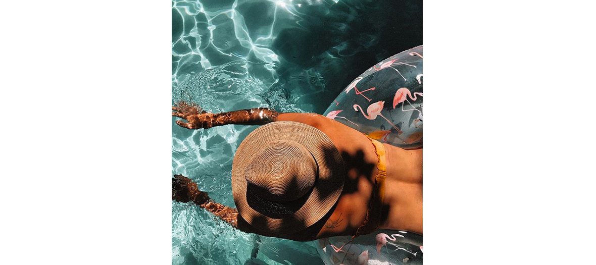 Instagram picture of a young woman wearing straw hat 