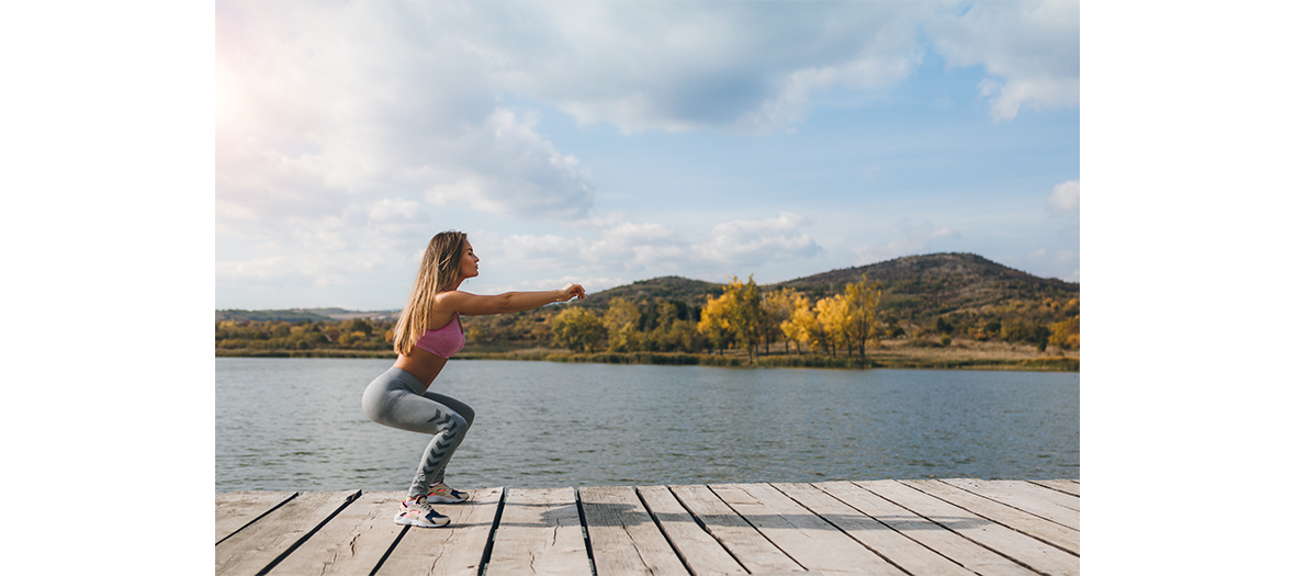 Young woman making squats