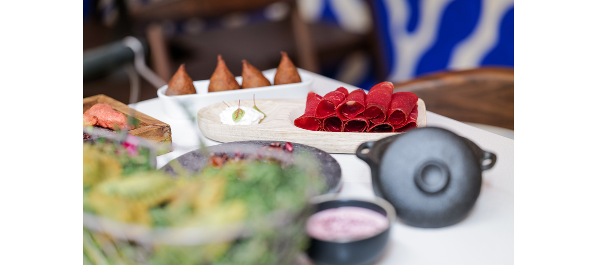 Mezze with Jerusalem artichoke caviar, pomegranate octopus, meat samosas, hummus / lamb hazelnut, smoked eel falafel