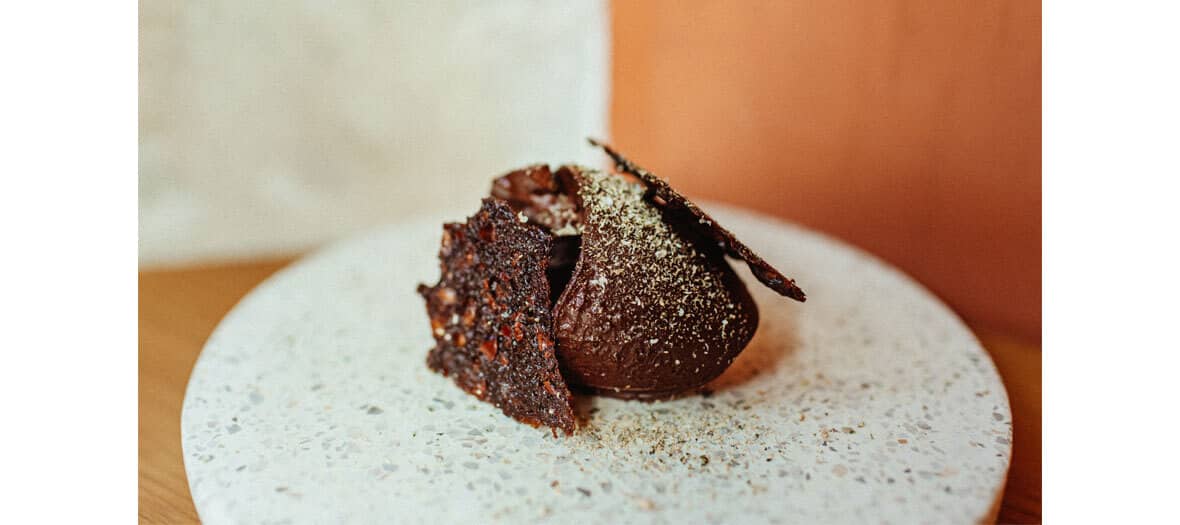 Dessert with Haïti ganache 85 % of Encuentro chocolate, thin tuile cocoa biscuits, caper powder at Alexandre Marchon's in Paris.