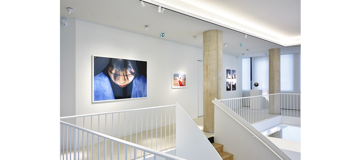 a white space with photographs, drawings, collages from the Galerie d'Art Lab of Agnes B