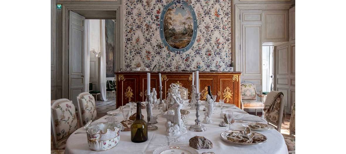 the dining room reconstituted as a scene of everyday life with wines and oyster plates and other favorite dishes of the 18th century