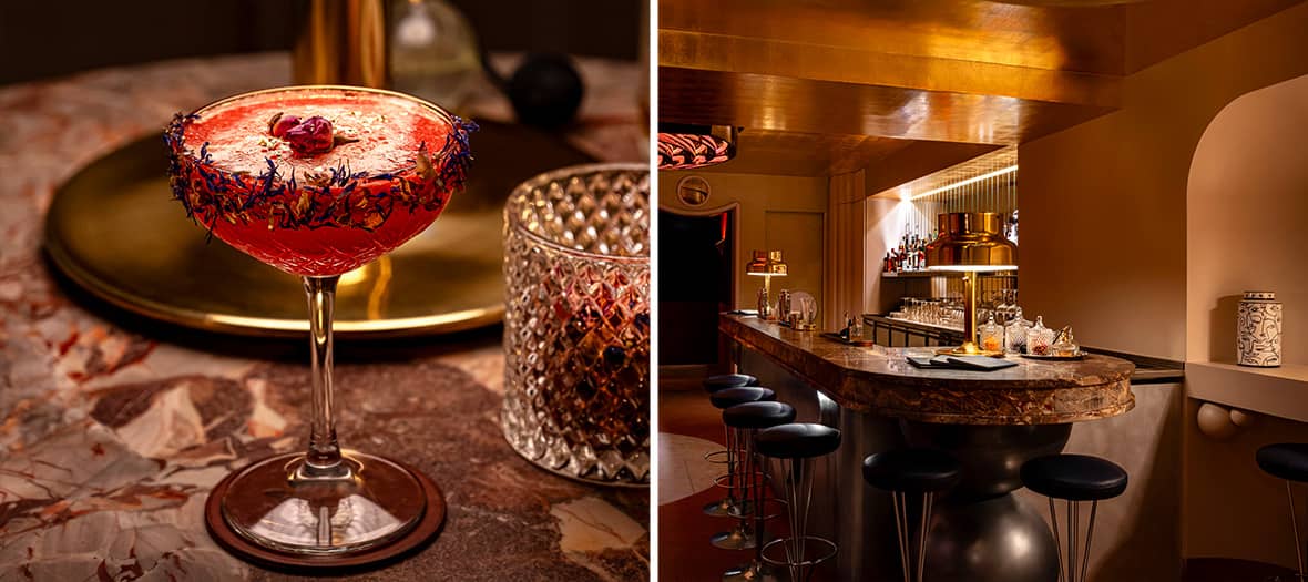 Cocktail raffin&eacute; pos&eacute; sur un comptoir en marbre dans un bar parisien &eacute;l&eacute;gant, ambiance cosy et chic.