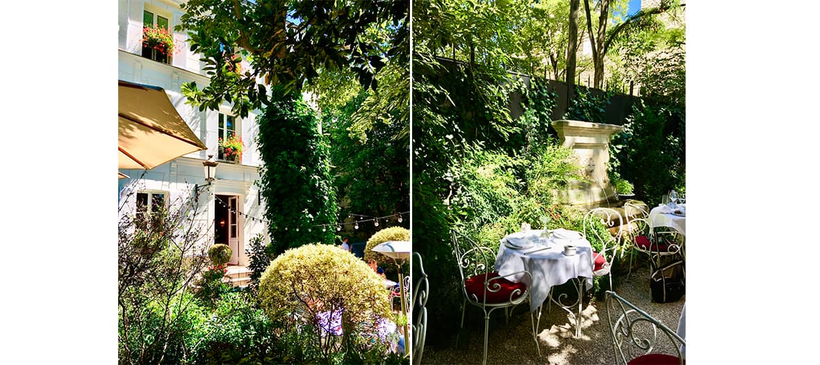 Terrasse verdoyante et tables dressées dans le jardin caché de l’Hôtel Particulier Montmartre, lieu intimiste et romantique à Paris.