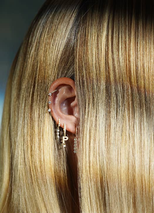 Piercing en or et diamants de la maison Persée Paris, style raffiné et moderne.