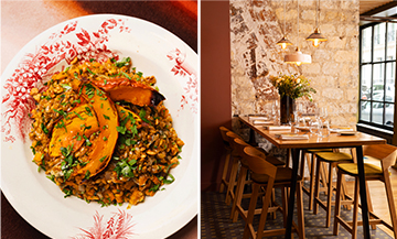 Intérieur du bistrot Schnock à Paris avec murs en pierre, tables en bois et ambiance chaleureuse dans le 17e arrondissement.