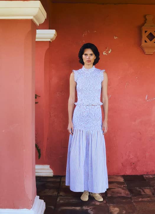 The Long Owl Skirt stands out with its comfortable smocked waist and summery red-and-blue striped pattern mariadelaorden